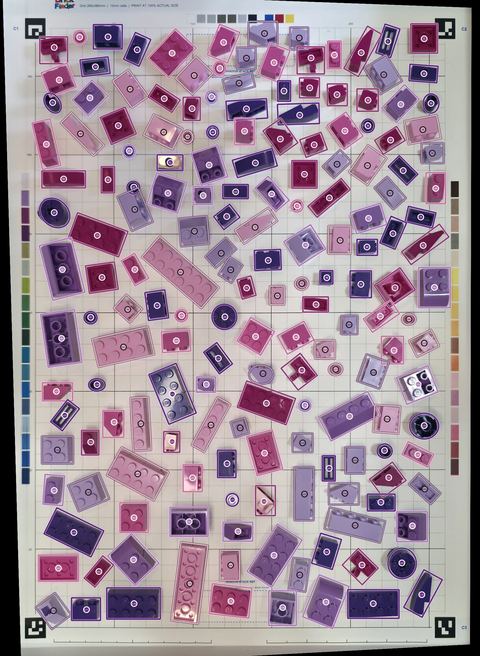 A real tray, every piece outlined: A real photo of a tray of pink and purple bricks, with every piece outlined by BrickVision.